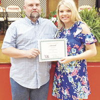 The Waymatic Scholarship was awarded to Chelsea Johnson, right, by Blake Johnson, left, who is Waymatic employee and Chelsea’s father at the recent Hickman County High School Honors Night. (Photo submitted)