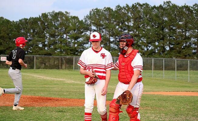 South Fulton High School Red Devils Bryce McFarland and Garrett Slaughter discuss strategies during baseball action last week, as the Devils suffered two losses, at the hands of Hickman County and Bradford. (Photo by Jake Clapper.)