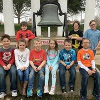 HCES TOP STUDENTS FOR MARCH – Hickman County Elementary School recently recognized its Students of the Month for March. The character trait emphasized in March has been Friends: Be One to Have One. Primary students selected by teachers include: front row, from left, P.J. Nelms, Janna Kay Frizzell, Hayden Shadowens, Swayze Millett, Jace Webb, and Joseph Keefer; back row, from left, Kyler Sullenger, Vance Barnt-Terry, and Braxton Cross. Not pictured is Dathan Sanderson and Rebecca Jordan. The primary students are pictured with the old school bell used by Central Elementary that is located on the school grounds. (Photo submitted)