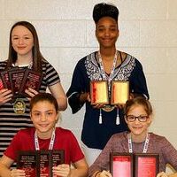 SOUTH FULTON MIDDLE SCHOOL LADY RED DEVILS AWARDED – Among award recipients at the recent South Fulton Middle School sports awards banquet were SFMS Lady Red Devils basketball team members, front row, left to right, Aubree Gore, Best Defensive player; Most Assists, Most Improved Rebounder; Anna Gore, Most Improved Defensive Player, 110% Award; back row, Makenna Naugle, Most Improved Offensive Player, Most Steals, Best Free Throw Percentage, Academic Award; Tolesha Mason, Best Offensive Player, 250 points, Best Rebounder, 175. (Photo by Jake Clapper.)