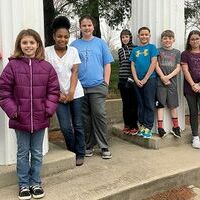 STUDENTS OF THE MONTH AT HCES – Hickman County Elementary School recently recognized its Students of the Month for March. The character trait emphasized in March has been Friends: Be One to Have One. Intermediate students chosen by teachers for Student of the Month include: from left, Will Lupton, Carly Bradley, Naziah Powell, Katie Abernathy, Jacob Grissom, Quez Irons, Jax Hunter, Kaylee Seaton, Jennifer Norwood, and Kady Stinson. The students are pictured with replicated columns from the old Central Elementary located on the grounds of the school. (Photo submitted)